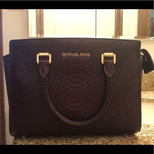 Michael Kors boutique handbag. Damson color.